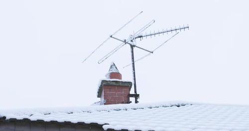 Snow covered chimney tv aerial