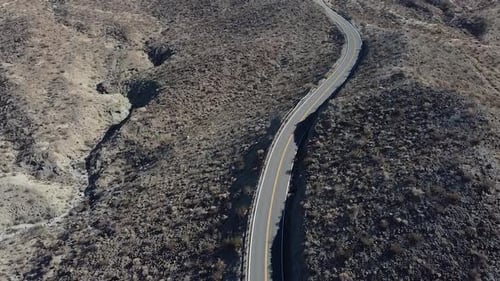 Lonely car drives on California highway number 74, aerial drone shot