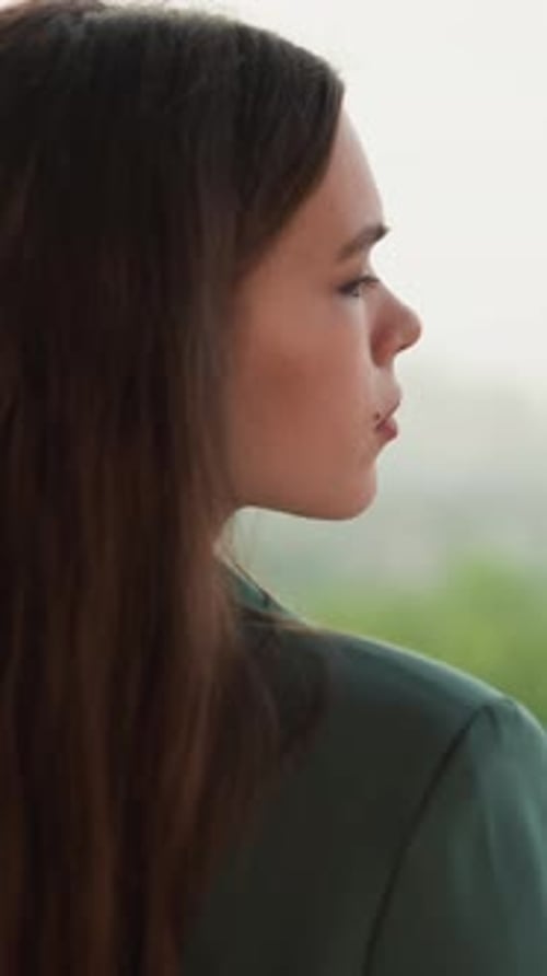 Woman with Long Brown Hair in Side Profile