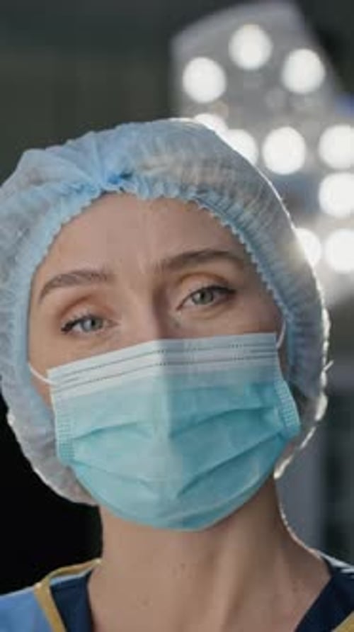 Female Surgeon Looking at Camera