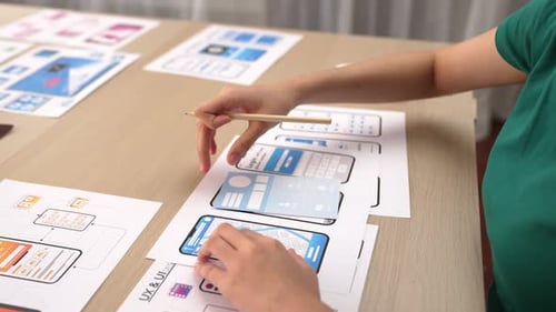 UX UI designer of startup company in workplace plan on user interface. Synergic