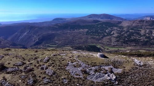 High angle aerial view mountains around Coursegoules village in France