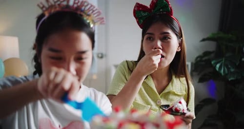 Two Women Celebrate Birthday with Cake Indoors