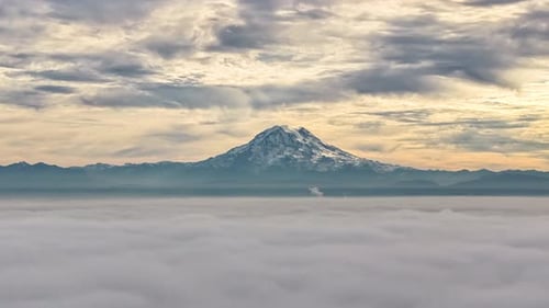 Clouds Moving Above And In Front Of Mount Rainier At Dusk In Washington, USA. timelapse