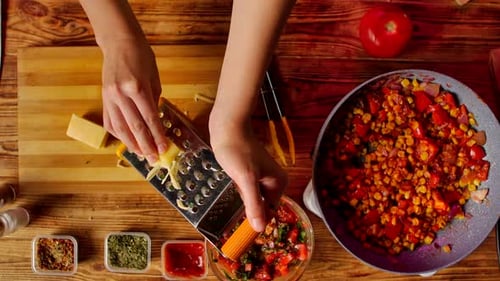 Young Woman Preparing Colorful Quesadilla in Kitchen