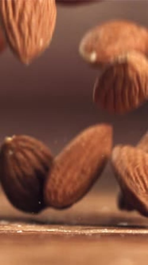 Almonds Fall on the Table Filmed on a Highspeed Camera at 1000 Fps