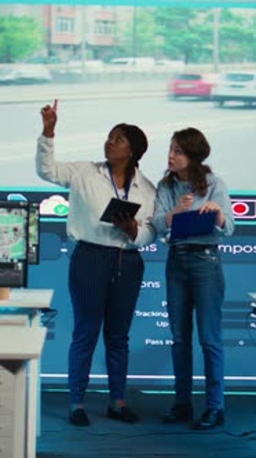 Vertical Video Team of Control Center Employees Gather Intelligence About Cars in Traffic