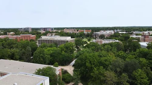 Aerial shot of the Administration Building at Michigan State University. Smooth Pull back motion.