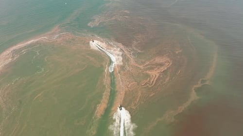 Jetski roaring across the open waters of The Mediterranean Sea, Aerial follow footage