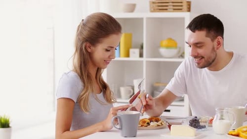 Affectionate Couple Enjoying Delicious Breakfast at Sunny Home