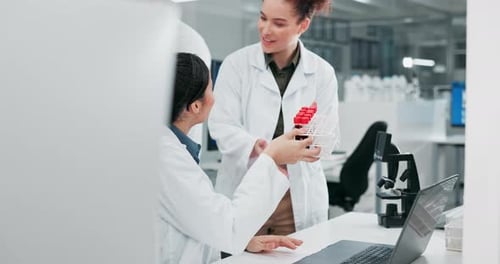 Women, scientist and together for blood sample in lab with research, discussion