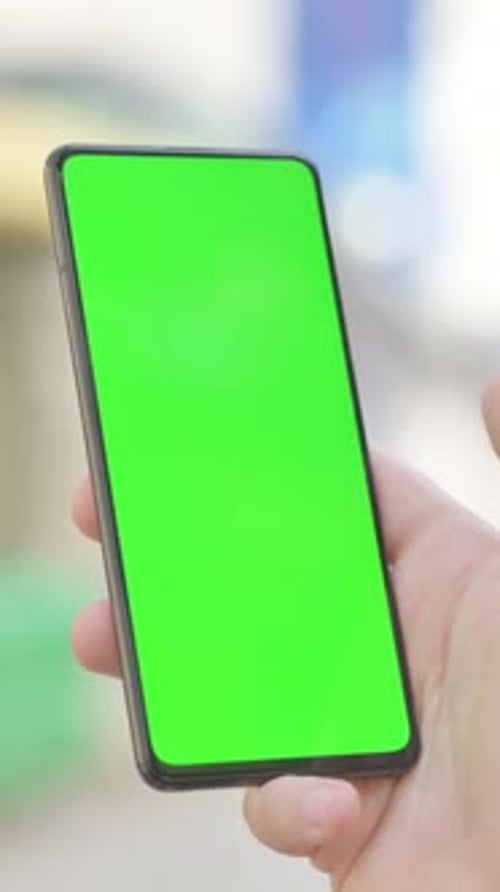 Modern Young Man with Green Screen Phone Outdoor, Vertical Video