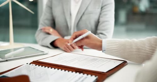 Handshake, signature and business people with contract, deal or agreement in office