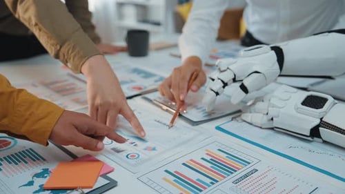 Team Meeting with Robot Arm Analyzing Data Charts