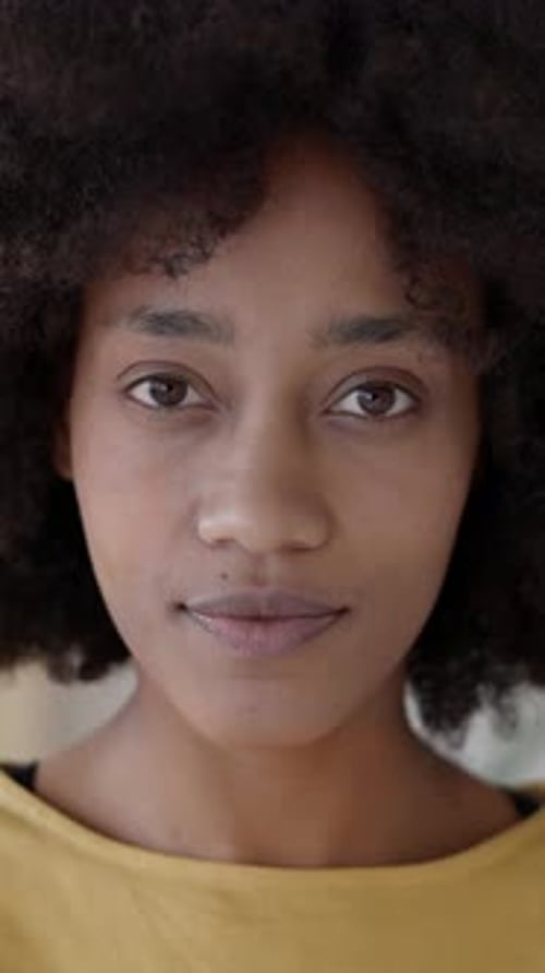 Close-up Portrait of a Smiling Woman with Afro Hair