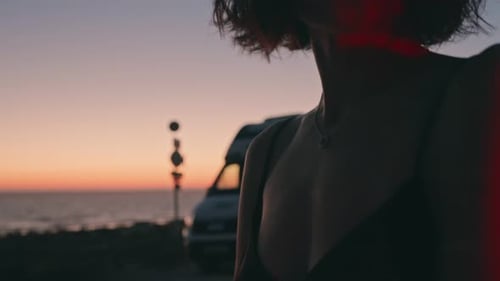 Woman Posing at Sunset on the Beach