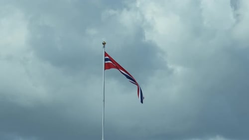 Flag Waving in the Cloudy Sky
