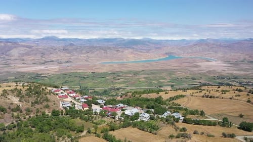Aerial View Of River And Village On Mountain Slope