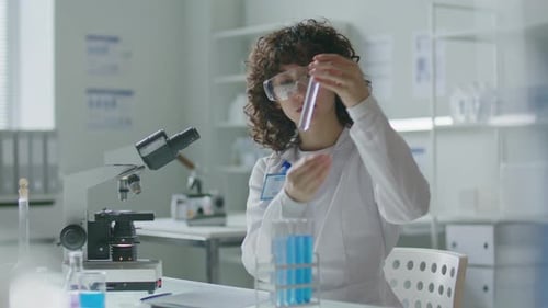 Scientist Analyzing Test Tube in a Laboratory