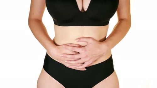 Woman touching stomach painful suffering from stomachache causes of menstruation period, gastric ulc