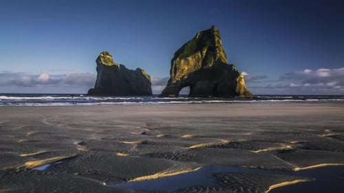 Majestic Sea Stacks Standing Tall On Remote Deserted Twilight Beach