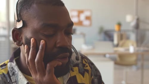 African American Man Working in Call Center Close Up