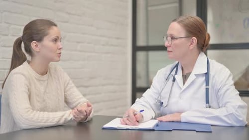 Doctor and Patient Talking in Medical Office