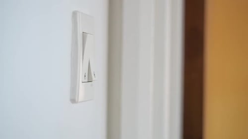 Finger Turning Light Switch On and Off