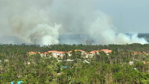 View From Above of Lagre Wildfire Burning Severely in North Port City Florida Hot Flames in Forest