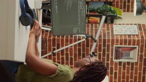 Relaxed Woman Working on Computer with Headphones