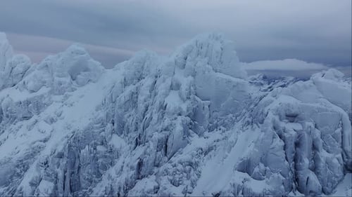 Alpine Tranquility Experience the Serenity of Cold Mountain Tops Covered in Snow and Ice Through