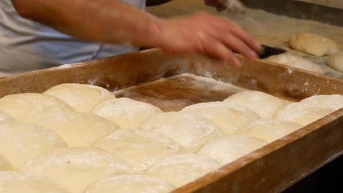 Baker Preparing Dough in a Commercial Kitchen