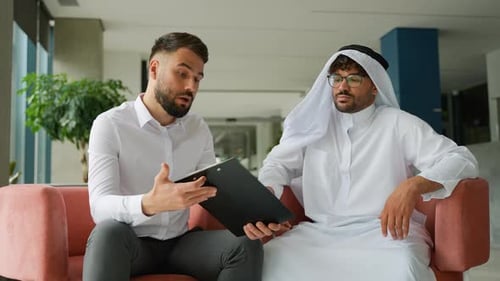 Businessmen Talk in Office Meeting