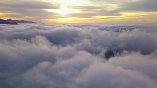 Fly Above Clouds in Misty Nature Heaven Landscape at Golden Sunrise Aerial View
