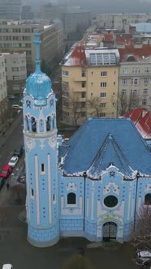 vertical Blue Church of Bratislava in winter, aerial view