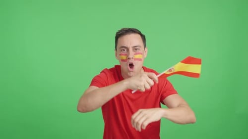 Enthusiastic Man Waving Spanish Flag and Cheering