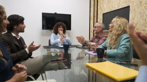 Business Team Meeting and Clapping Hands