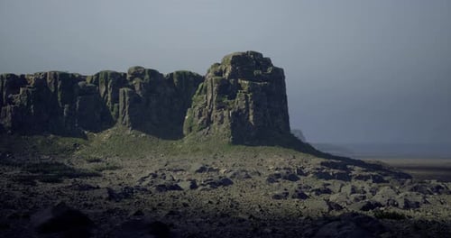 Majestic Rocky Cliff Formations in a Tranquil Coastal Landscape at Dusk