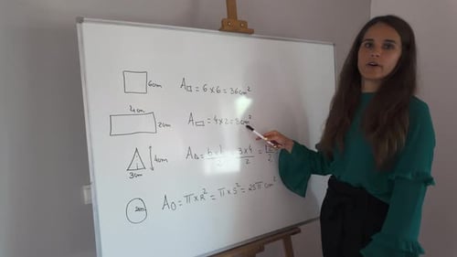 Girl explaining geometric area formulas on a whiteboard