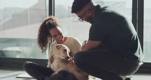 Couple Pets Dog Together at Home