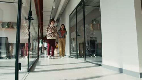 Team of SMM Discussing Content Plan Walking in Office