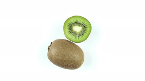 Half And Whole Kiwi On A White Background.