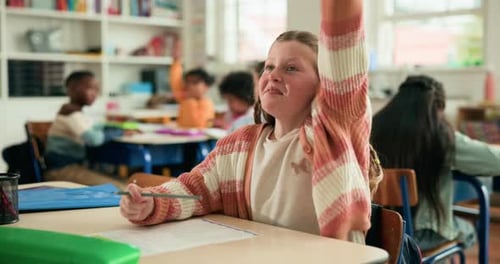 Raised hand, question and child in classroom at school for learning, education or development