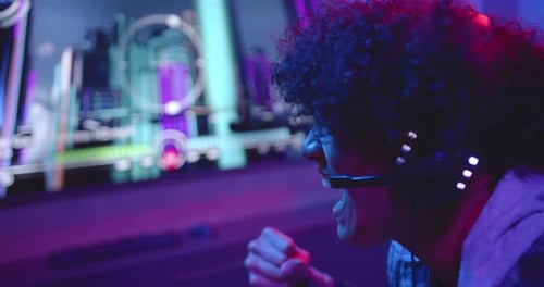 Excited Gamer Clenches Fist Watching Computer Monitor