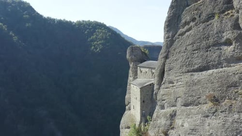 ancient castle in a mountain near Genova, Liguria, Italy. panning drone shot