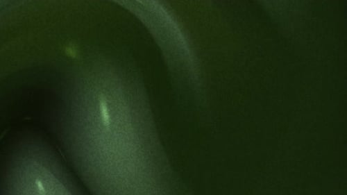 Dark Green Abstract Liquid Flow Background With Subtle Light Streaks and Grain Texture