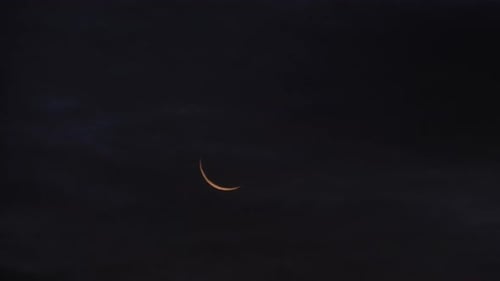 Crescent Moon in the Night Sky at Dusk
