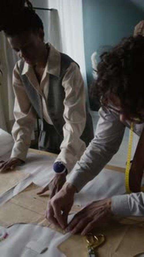 Team Working on Fashion Design in Bright Studio