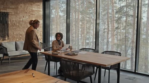 Business Review in Open Office Space with Winter View