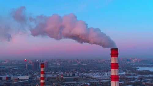 Winter city smog from factory chimneys aerial view of industrial pollution